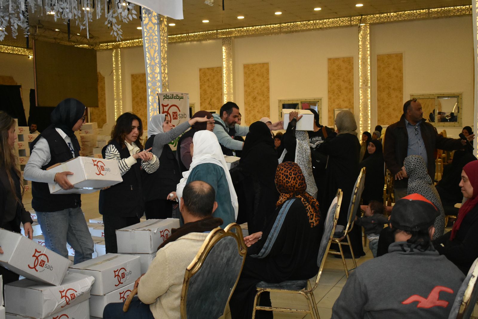 بنك saib يوزع كراتين رمضان بالتعاون مع جمعية الأورمان